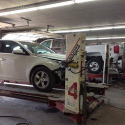 Sean's Collision Repair - 2 modern drive on frame machines  with laser measuring system for accurate repairs