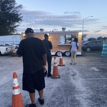 Reed's Catering & Concessions - a group of people standing in a parking lot - Seafood Near Me - Miami, Florida Reed's Catering & Concessions - a group of people standing in a parking lot - Seafood Near Me - Miami, Florida