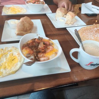 Biscuit - Shrimp and Grits, a fried egg, biscuits, a short stack of pancakes, and a cappacinno. - Breakfast & Brunch Near Me - Frisco, Texas Biscuit - Shrimp and Grits, a fried egg, biscuits, a short stack of pancakes, and a cappacinno. - Breakfast & Brunch Near Me - Frisco, Texas