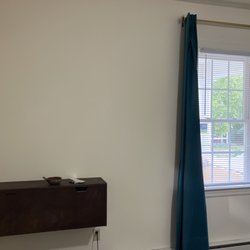 Craig's Touch Fix & Repair - antique desk, wall mounted  curtain rods & curtains hung.