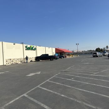 SaveCo - a parking lot with cars parked in it - Grocery Near Me - Exeter, California SaveCo - a parking lot with cars parked in it - Grocery Near Me - Exeter, California