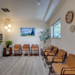 Mark Graham, DDS - Comfy spots in our chill waiting room with water dispenser.