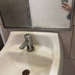 Dirty sink and mirror Dirty sink and mirror