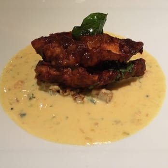 Indian Accent - This fish was delicious and I could have picked the plate clean of the curry broth! - Indian Near Me - New York, New York