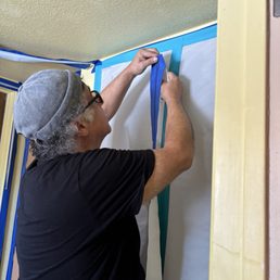 Enrique setting up care for my office while they worked. Enrique setting up care for my office while they worked.