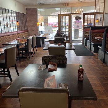 Kinzi - a restaurant with tables and chairs - Mediterranean Near Me - Mission, Kansas Kinzi - a restaurant with tables and chairs - Mediterranean Near Me - Mission, Kansas