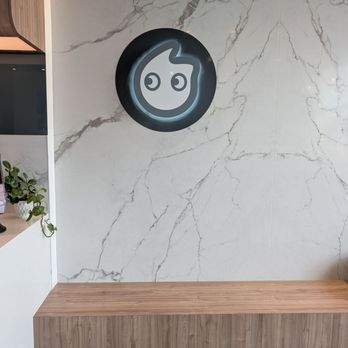 CoCo Fresh Tea & Juice - Bench seating with the logo - Bubble Tea Near Me - Toronto, Ontario