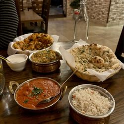Chaska Bar & Grill - Lamb Biryani with Raita, Garlic Naan, Butter Chicken, and Chili Naan