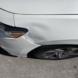 Chicago Auto Body & Repair - Dent by someone else.