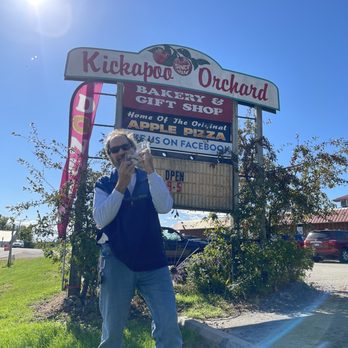1913 Kickapoo Orchard - a woman taking a selfie in front of a restaurant - Farmers Market Near Me - Gays Mills, Wisconsin