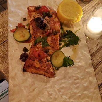 Piccola Cucina Uptown - Salmon, served on a trendy plate. - Sicilian Near Me - New York, New York Piccola Cucina Uptown - Salmon, served on a trendy plate. - Sicilian Near Me - New York, New York