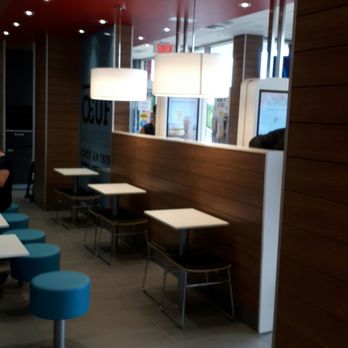 McDonald's - a man sitting at a table in a restaurant - Fast Food Near Me - Beauport, Quebec McDonald's - a man sitting at a table in a restaurant - Fast Food Near Me - Beauport, Quebec