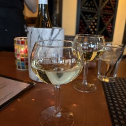 The Caroline - Wine down Wednesday! Wine bottles are 1/2 off!
