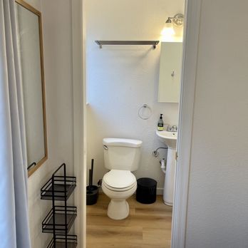 Rdz Construction - a bathroom with a toilet and sink - General Contractors Near Me