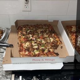 Half sheet supreme and half sheet pepperoni with garlic, Parmesan, chicken, wings and barbecue chicken wings Half sheet supreme and half sheet pepperoni with garlic, Parmesan, chicken, wings and barbecue chicken wings
