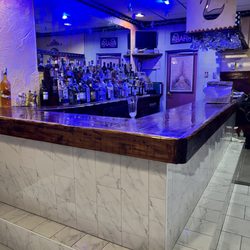 Golden Swan - New marble tile on bar!