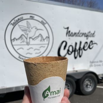Balance Me Out - a hand holding a cup of coffee - Coffee & Tea Near Me - Sacramento, California