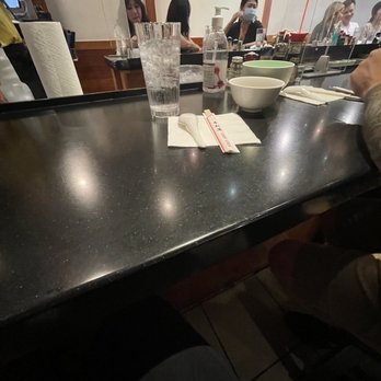 Ramen Nakamura - Seating with plastic barriers between customer groups - Ramen Near Me - Honolulu, Hawaii