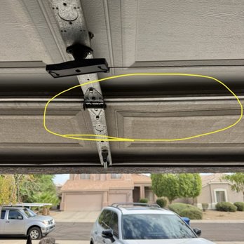 SOS Garage Doors - Warping of door from stress crack starting. - Garage Door Services Near Me - Phoenix, Arizona SOS Garage Doors - Warping of door from stress crack starting. - Garage Door Services Near Me - Phoenix, Arizona