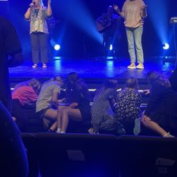 New Beginings Fellowship - Teens praying over prayer requests from others in the community.