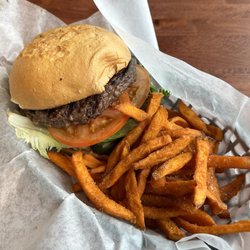 Gluten free bun, medium well burger with sweet potato fries