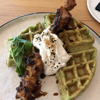 Radio Social - Falafel waffle with grilled chicken skewer, maple labneh and date molasses - Bars Near Me - Rochester, New York Radio Social - Falafel waffle with grilled chicken skewer, maple labneh and date molasses - Bars Near Me - Rochester, New York