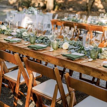 Angella Floral Design - Farm table greenery & florals and floating candles by Angella - Floral Designers Near Me - Sausalito, California