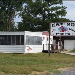 a mobile home with a sign for crawfish to go a mobile home with a sign for crawfish to go