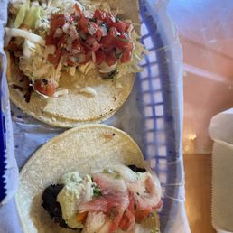 Fish taco and a crispy pork belly taco