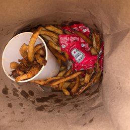 a basket of fries and a bowl of chips a basket of fries and a bowl of chips