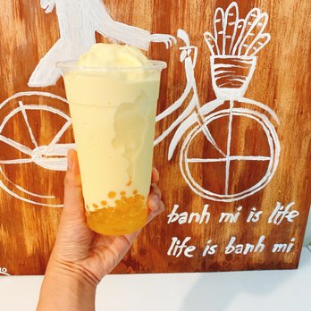 Banh Mi Bites - a hand holding a glass of bubble tea - Vietnamese Near Me - Mountlake Terrace, Washington Banh Mi Bites - a hand holding a glass of bubble tea - Vietnamese Near Me - Mountlake Terrace, Washington