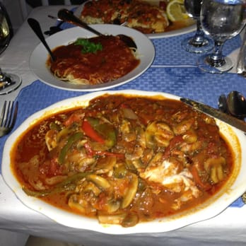Chef Vola's - Chicken cacciatore, side of pasta, my wife's orange roughy fish dish in the back. - Italian Near Me - Atlantic City, New Jersey