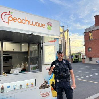 Peachwave 915 - a man standing in front of a food truck - Ice Cream & Frozen Yogurt Near Me - El Paso, Texas
