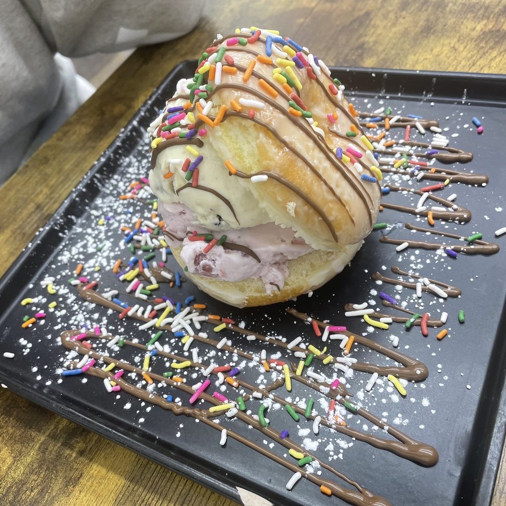 Crepe House - Glazed Donut with vanilla and strawberry ice cream and sprinkles - Waffles Near Me - The Bronx, New York Crepe House - Glazed Donut with vanilla and strawberry ice cream and sprinkles - Waffles Near Me - The Bronx, New York