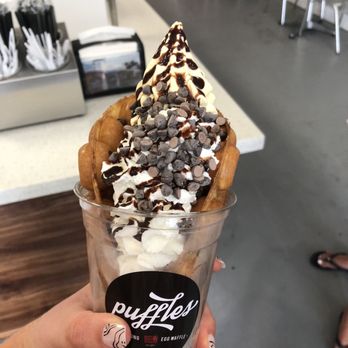 Puffles - Waffle cone with banana soft serve and whipped cream, chocolate chips, and chocolate drizzle - Desserts Near Me - Hollywood, Florida Puffles - Waffle cone with banana soft serve and whipped cream, chocolate chips, and chocolate drizzle - Desserts Near Me - Hollywood, Florida