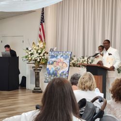 Madison Avenue Florist - We accented our speaking space beautifully with these arrangements! (closer)