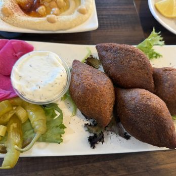 Zaman Mediterranean Fresh - Kabbeh (bulgar wheat fried shell stuffed with ground beef) - Mediterranean Near Me - Denver, Colorado Zaman Mediterranean Fresh - Kabbeh (bulgar wheat fried shell stuffed with ground beef) - Mediterranean Near Me - Denver, Colorado