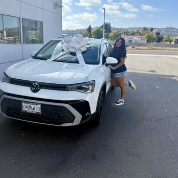 Capistrano Volkswagen - Daughter with her first car. - Car Dealers Near Me - San Juan Capistrano, California Capistrano Volkswagen - Daughter with her first car. - Car Dealers Near Me - San Juan Capistrano, California