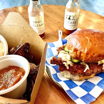 Belfare - Classic chicken sandwhich and their furikake fingerling potatoes along with the house made ketchup and aioli. Hot sauces in the back - Food Stands Near Me - Petaluma, California