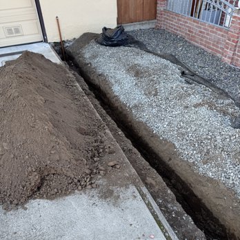 Red Wrench Plumbing - trench to house and pipe entering the garage. - Plumbing Near Me - San Francisco, California Red Wrench Plumbing - trench to house and pipe entering the garage. - Plumbing Near Me - San Francisco, California