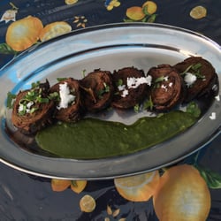 Saattveek - Taro leaves dipped into chickpea batter, served with fresh coriander chutney and coconut chutney. Not dried coconut either