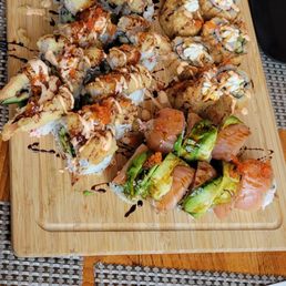 a plate of sushi and chopsticks a plate of sushi and chopsticks