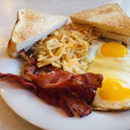 Early Bird with over easy eggs, bacon, toast and hash browns.