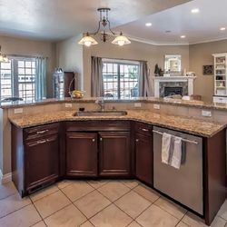 This was a new build, we built the island and installed the cabinets, appliances, and tiled the floor.