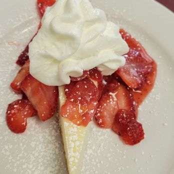 Ely's Restaurant - Cheesecake with strawberries and powdered sugar.... Great after a meal that was also great. - Breakfast & Brunch Near Me - Las Vegas, Nevada