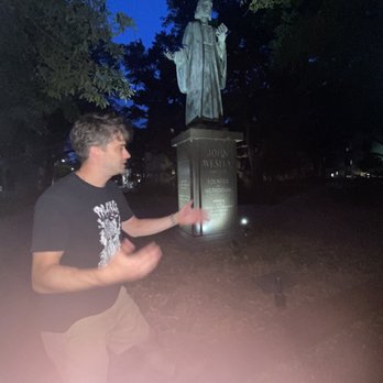 History, Haunts and Hops - a man standing in front of a statue - Walking Tours Near Me History, Haunts and Hops - a man standing in front of a statue - Walking Tours Near Me