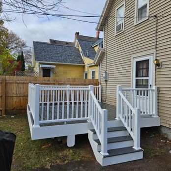 Orelvis General Contracting - Composite white handrails small deck - General Contractors Near Me - Rochester, New York Orelvis General Contracting - Composite white handrails small deck - General Contractors Near Me - Rochester, New York