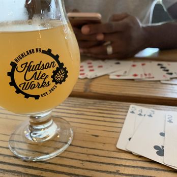 Hudson Ale Works - a glass of beer and playing cards - Breweries Near Me - Highland, New York