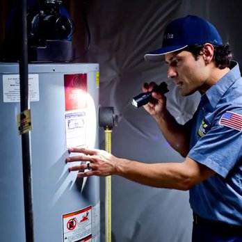 Michael & Son Services - Michael & Son technician carefully inspecting a water heater to help prevent leaks, surprises, and cold showers. - Plumbing Near Me - Raleigh, North Carolina Michael & Son Services - Michael & Son technician carefully inspecting a water heater to help prevent leaks, surprises, and cold showers. - Plumbing Near Me - Raleigh, North Carolina