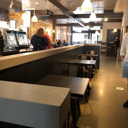 people at the counter of a restaurant